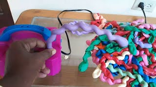 Blowing long balloons with balloon machine [upl. by Fulmis]