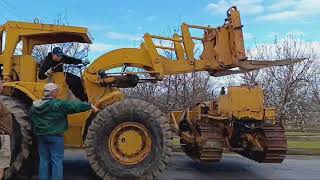 UNLOADING THE INTERNATIONAL DOZER AT ITS NEW HOME WITH THE CAT 966 LOADER [upl. by Mazur]