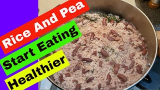 Jamaican Rice And Peas Recipe With Coconut Milk  Bob Marley Favorite Food [upl. by Cilegna]