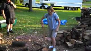 Man shows Woman how to split wood [upl. by Kcirrad247]