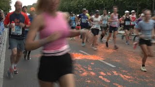 Berlin marathon disrupted by climate activists  AFP [upl. by Esiuole]