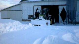 John Deere 8430 Plowing through 6 foot snow drift [upl. by Tnahsarp]