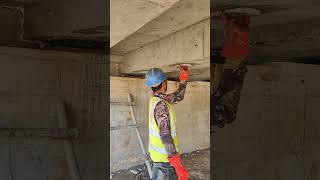 Worker use Sika Grout to plastering concrete beams for repairs [upl. by Ciredec380]