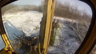 Dynahoe backhoe clearing bush [upl. by Ahsiemac]