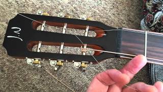 Restringing a slotted headstock guitar [upl. by Hakym]