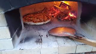 Homemade pizza from a woodburning oven Vermiculite pizza oven Subscribe to see more pizza videos [upl. by Thorman]