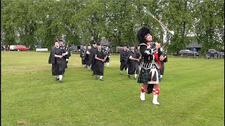 Mace flourish from Drum Major leading Kintore Pipe Band march during 2024 Oldmeldrum Highland Games [upl. by Sampson]