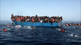 I migranti finiscono in mare il video del drammatico salvataggio [upl. by Enamrahs]