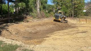 Deere 333g grading and shaping bank [upl. by Eidaj902]