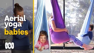 Aerial babies cocooned in silk hammock’s toddlers destress with their mums  ABC Australia [upl. by Cos]