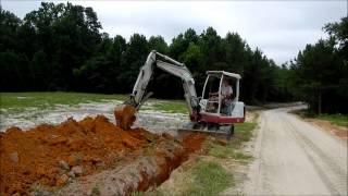 Trenching with the Mini Excavator [upl. by Lemhaj942]