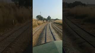 Beautiful live view of train in curve crossing Kaluwal railway station in mountains Pakistan shorts [upl. by Aicirtap969]