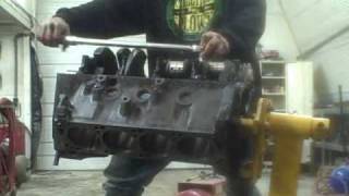 Engine Assembly Part 3 torquing main cap bolts [upl. by Drwde414]