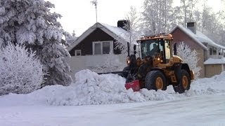 Volvo L70G  Cleaning snow of sidewalks [upl. by Edahsalof]