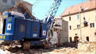 Demolition a building with a Menck M152 clamshell crane FujiHS20EXR [upl. by Nette]