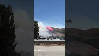 DC10 dropping PhosChek fire retardant on fire near Gorman California [upl. by Akinirt]