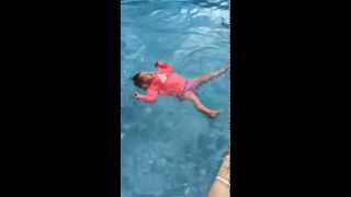 Baby falls into pool and back floats on her own [upl. by Eckhardt142]