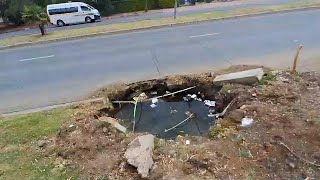 Burst pipe and big hole in the road in Bloemfontein in South Africa [upl. by Tychonn516]