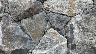 Secrets to creating a beautiful NATURAL STONE WALL Insights from a real stonemason [upl. by Soilissav]