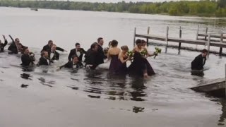 WATCH Wedding party falls into lake when dock collapses [upl. by Alebasi199]