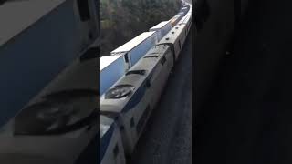 Super Fast Amtrak Speeds Past CSX Train At 80 MPH Overhead View [upl. by Amliv825]