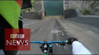 Biker films insane 60m bike dam drop in Slovenia  BBC News [upl. by Levey262]