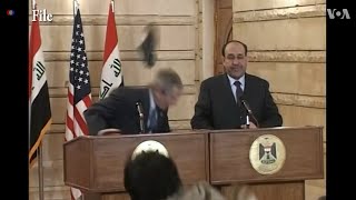 Iraqi journalist Muntadhar alZaidi throws his shoes at George W Bush [upl. by Carper822]