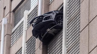 Car dangles out of parking deck [upl. by Hatnamas]