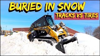 Tires or Tracks on a skid steer in Deep SnowCan you plow with a tracked loader [upl. by Nnoj]