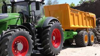 Komatsu PC 290 loads Fendt 1050 with topsoil [upl. by Ubald]