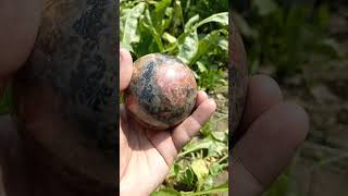 Polished rhodonite sphere afghanistan afghanite quartz afghanjewelry crystals gems gemstones [upl. by Eecram]