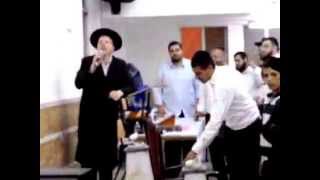 Charedi Rabbi Holds Public quotSmashing iPhone Ritualquot In Shul [upl. by Kantos]