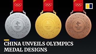 China unveils Winter Olympics medal designs [upl. by Aeslehc]