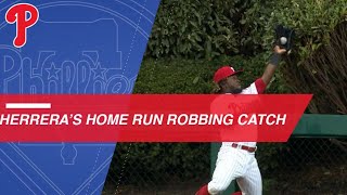 Odubel Herrera climbs the fence to rob a home run [upl. by Enal]