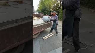 The Process of Manually Unloading Stone Balls from a Vehicle to the Ground [upl. by Nwahsuq]