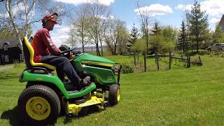 Brand new John Deere X584 mowing a residential lawn 05212018 [upl. by Hsatan]