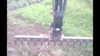 home made rake for mini digger 12610wmv [upl. by Anahsak]