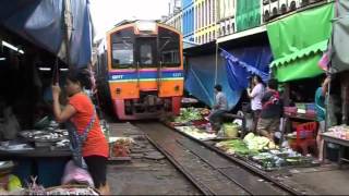 Train passes through Thai market [upl. by Northway186]