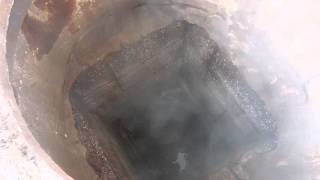 Steam Leaking Out Of A Manhole From Underground Pipeline [upl. by Eidnahs591]