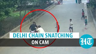 Watch Delhi chain snatching govt staffer shoved robbed  Crime on CCTV [upl. by Gurango]