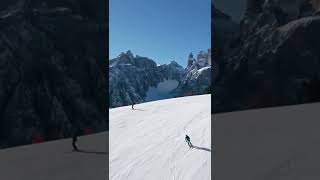 Aerial Shot Of Ski Slope And Skiers Going Downhill In Dolomites Italy Winter [upl. by Adnole102]