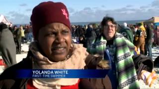 Hundreds brave cold temps for polar bear plunge [upl. by Ettenav]