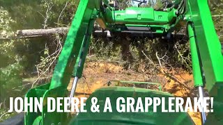 John Deere 5075E tractor and grapplerake working [upl. by Enitsuga]