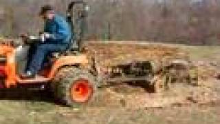 Kubota BX2200 Discing with duals [upl. by Dlareg]