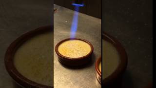 Caramelizing sugar on Crema Catalana at Cook amp Taste in Barcelona [upl. by Lhadnek]