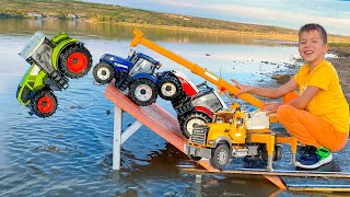 Darius rescues tractors from water with an excavator helping team Kidscoco Club [upl. by Fromma264]