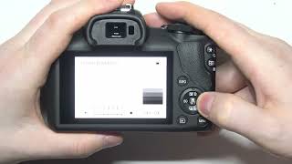 How To Change Display Brightness On Canon EOS R100 [upl. by Nosreve]