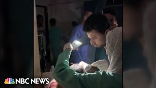 WATCH Staff in Gaza hospital use cellphone torch to light medical procedure [upl. by Gwenny]