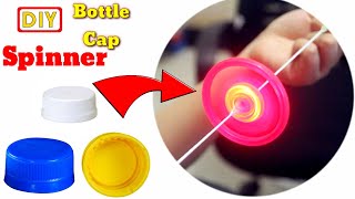 How to make spinning bottle caps  Spinner with bottle caps [upl. by Alledi]