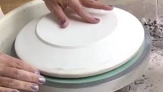 Using the pottery wheel to throw dinner plates on plaster forms [upl. by Neeruam]